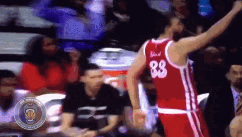 A Basketball Player Wearing A Red Jersey With The Number 88 On The Back GIF