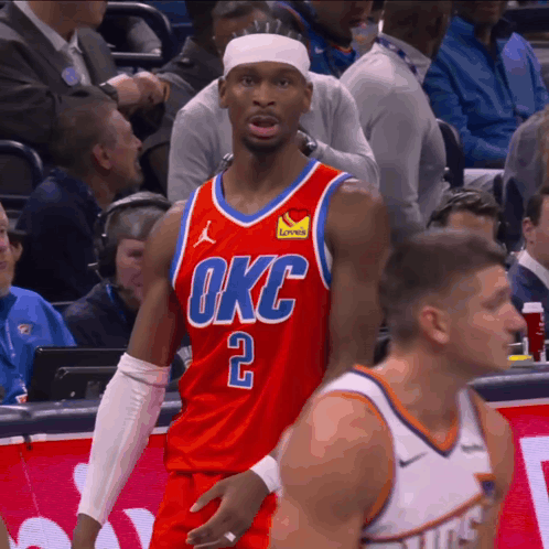 A Basketball Player Wearing A Red Okc Jersey Stands On The Court GIF
