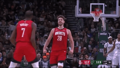 A Basketball Player Wearing A Red Rockets Jersey GIF