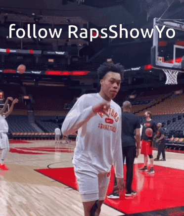 a basketball player wearing a shirt that says raptors basketball