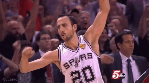 A Basketball Player Wearing A Spurs Jersey Is Celebrating With His Arms In The Air GIF