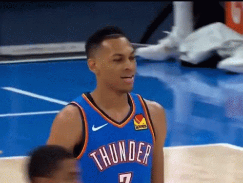 A Basketball Player Wearing A Thunder Jersey Stands On The Court GIF