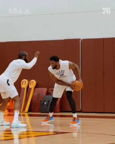 A Basketball Player Wearing A Tigers Jersey Is Dribbling The Ball GIF