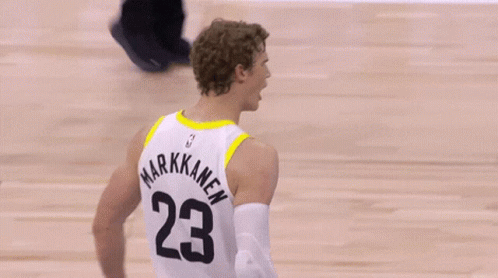 A Basketball Player Wearing A White Jersey With The Number 23 On It GIF