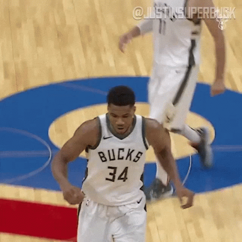 A Basketball Player Wearing A White Jersey With The Number 34 On It GIF
