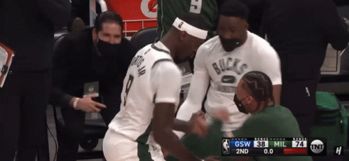 A Basketball Player Wearing A White Shirt That Says Bucks GIF
