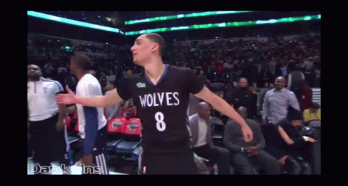 A Basketball Player Wearing A Wolves Jersey With The Number 8 GIF