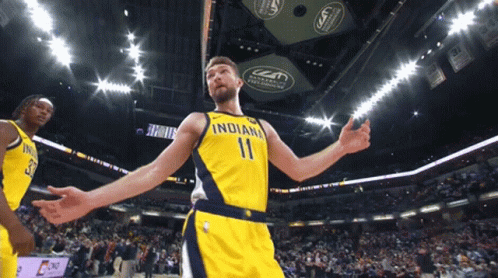 A Basketball Player Wearing A Yellow Indiana Jersey GIF