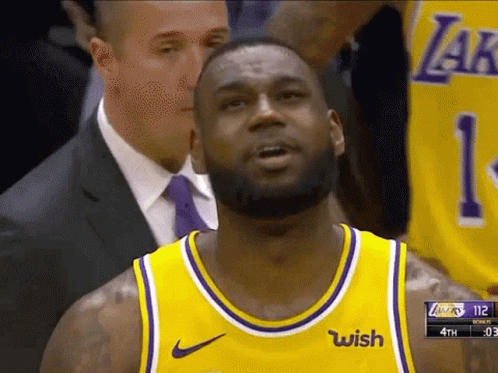 a basketball player wearing a yellow jersey that says wish on it