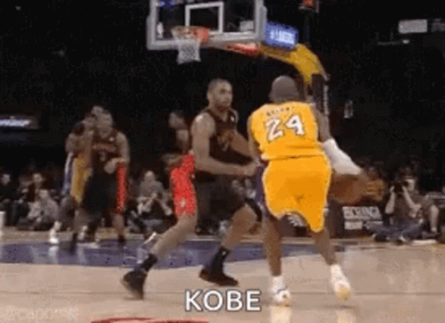 A Basketball Player Wearing A Yellow Jersey With The Number 24 On It Is Dribbling A Basketball . GIF