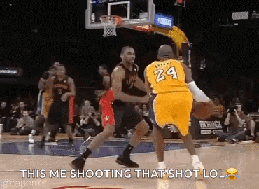 A Basketball Player Wearing A Yellow Jersey With The Number 24 On It Is Shooting A Shot . GIF