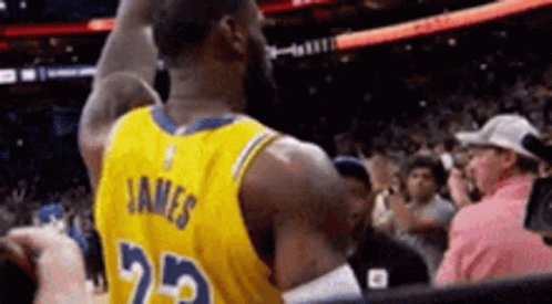 A Basketball Player Wearing A Yellow Jersey With The Number 25 On The Back GIF