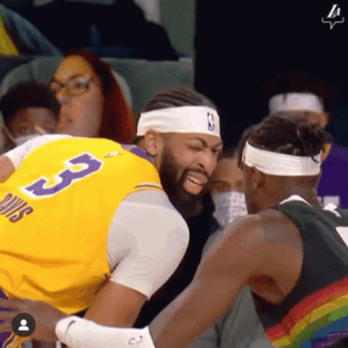 A Basketball Player Wearing A Yellow Jersey With The Number 3 On It GIF