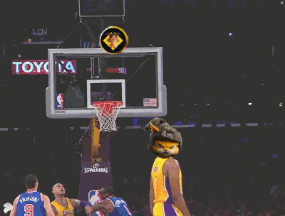 A Basketball Player Wearing A Yellow Lakers Jersey Throws A Ball GIF