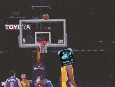A Basketball Player Wearing A Yellow Lakers Jersey Throws A Basketball Through A Hoop GIF