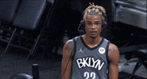 Basketball Player With Headphones And Brooklyn Jersey GIF