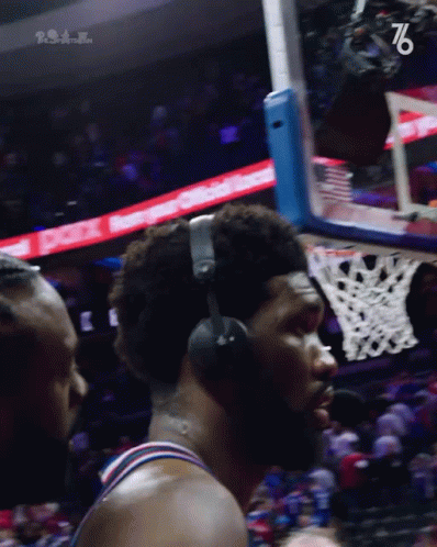 A Basketball Player Wearing Headphones With The Number 76 On The Bottom Left GIF
