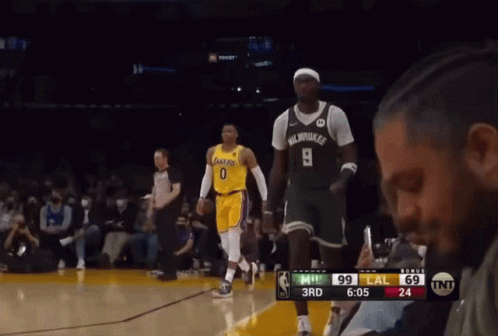 A Basketball Player Wearing Number 9 Stands On The Court During A Game GIF