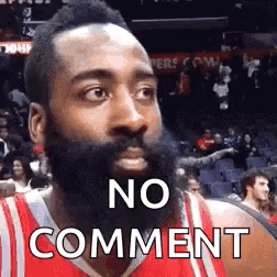 A Basketball Player With A Beard Is Wearing A Red Jersey And Making A No Comment Face . GIF