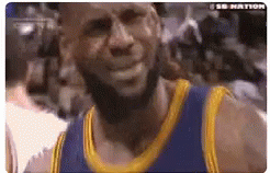 A Basketball Player With A Beard Wearing A Blue And Gold Jersey Is Smiling . GIF