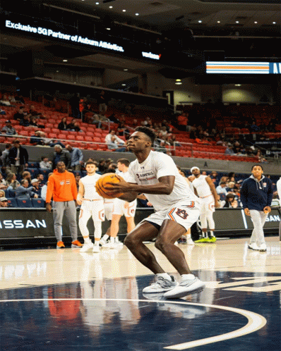 A Basketball Player With Auburn On His Shorts Holds The Ball GIF