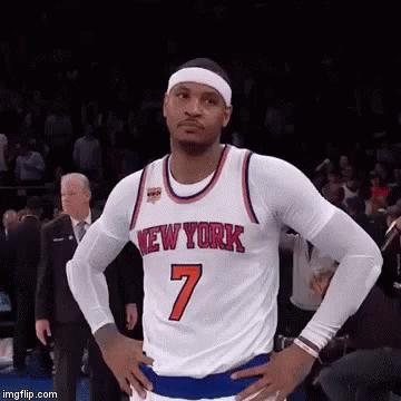 A Basketball Player With His Hands On His Hips Is Wearing A New York Jersey . GIF