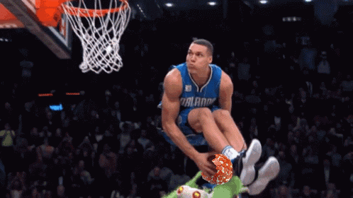 A Basketball Player With The Number 00 On His Jersey Is Dunking The Ball GIF