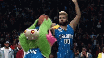 A Basketball Player With The Number 00 On His Jersey Stands Next To A Mascot GIF