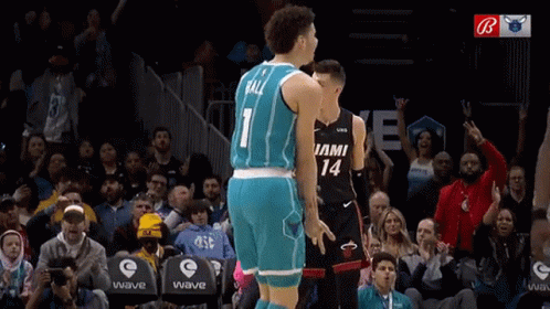 A Basketball Player With The Number 1 On His Jersey Is Standing Next To Another Player With The Number 14 On Their Jerse GIF