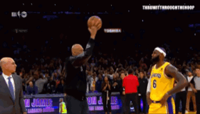 A Basketball Player With The Number 10 On His Jersey Shakes Hands With A Fan GIF