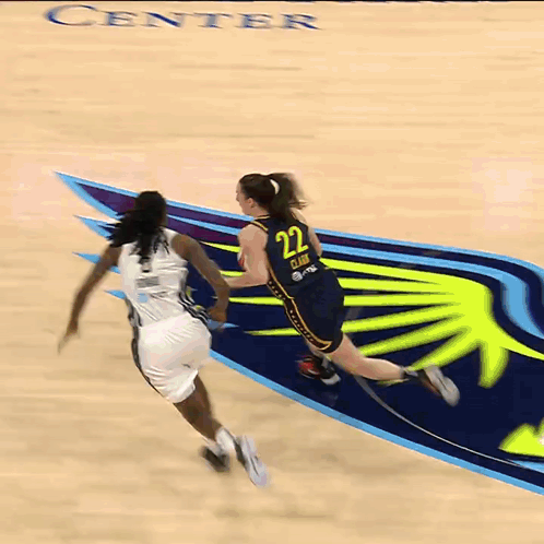A Basketball Player With The Number 11 On Her Jersey Tries To Block A Shot GIF