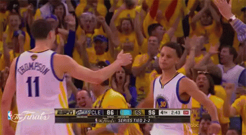A Basketball Player With The Number 11 On His Jersey Is Giving A High Five To Another Player . GIF