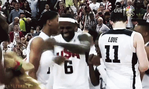 a basketball player with the number 11 on his jersey is hugging another player