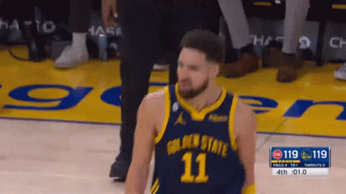 A Basketball Player With The Number 11 On His Jersey Stands On The Court GIF