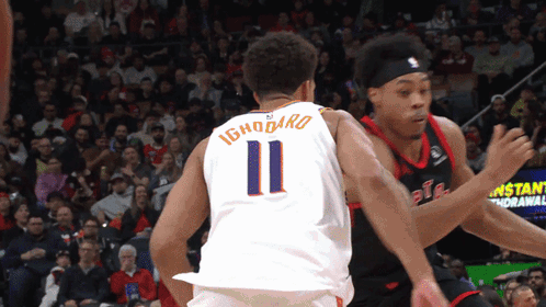 a basketball player with the number 11 on the back of his shirt