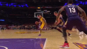 A Basketball Player With The Number 13 On His Back Dribbles The Ball GIF
