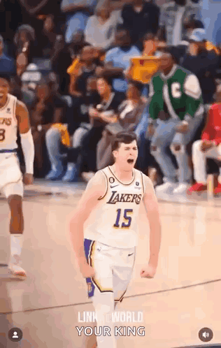 a basketball player with the number 15 on his jersey is celebrating on the court during a game .