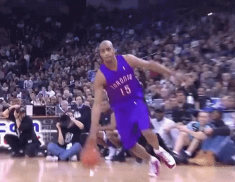 A Basketball Player With The Number 15 On His Jersey Is Dribbling The Ball GIF
