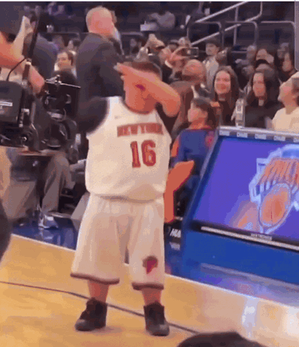 A Basketball Player With The Number 16 On His Jersey Is Dancing GIF