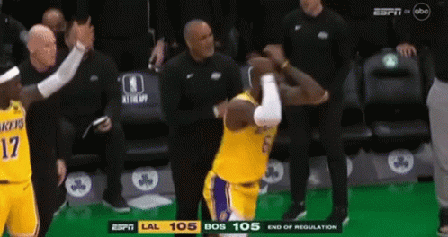 A Basketball Player With The Number 17 On His Jersey Is Standing In Front Of A Referee . GIF