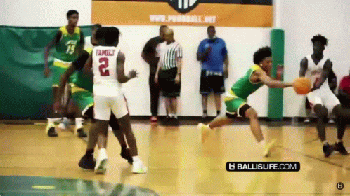 A Basketball Player With The Number 2 On His Back Is Dribbling The Ball GIF