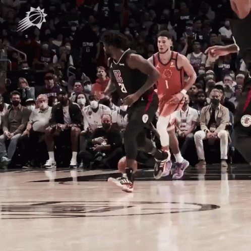 A Basketball Player With The Number 2 On His Jersey Is Dribbling The Ball GIF