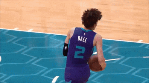 A Basketball Player With The Number 2 On His Jersey Is Running With The Ball GIF