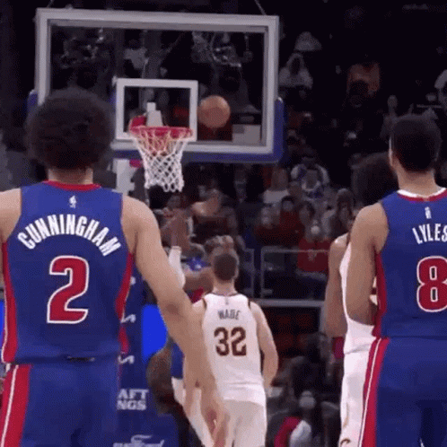 A Basketball Player With The Number 2 On His Jersey Is Standing Next To Another Player . GIF