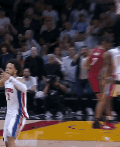 A Basketball Player With The Number 2 On His Jersey Stands On The Court GIF
