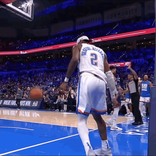 A Basketball Player With The Number 2 On The Back Of His Shirt GIF