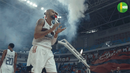 A Basketball Player With The Number 20 On His Jersey Stands On The Court GIF