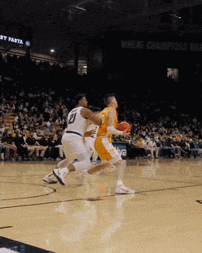 A Basketball Player With The Number 21 On His Shirt GIF