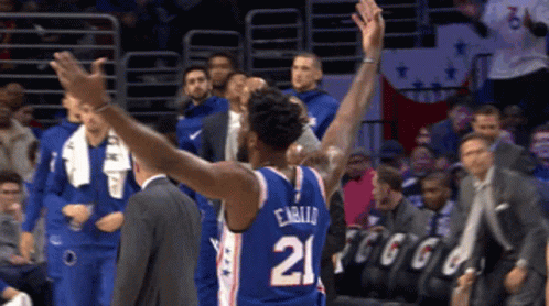 A Basketball Player With The Number 21 On The Back Of His Shirt GIF