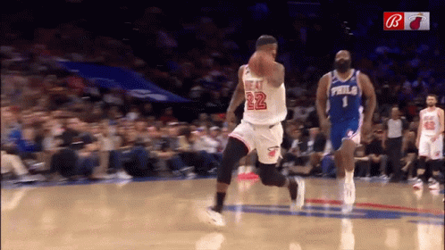 A Basketball Player With The Number 22 On His Jersey Dribbles The Ball GIF